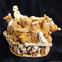 Front view of the Harmony Kingdom 'Unbearable' figurine showing bears piled on top and human figures beneath the platform.