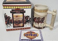 Photo showing the collectible Budweiser Clydesdale Hitch stein alongside original box and certificate of authenticity, indicating unused condition.