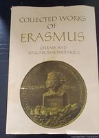Front cover of the hardcover book showing title, subtitle, and circular embossed gold medallion with bust of Erasmus.