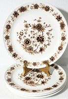 Set of 4 Royal Doulton Steelite vintage dinner plates stacked with floral brown pattern on white ceramic.