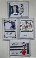 Front view showing four autographed and jersey cards from LA Dodgers rookies Dustin May, Tony Gonsolin, Brusdar Graterol, Edwin Rios and Matt Thaiss with visible blue ink signatures and memorabilia patches.