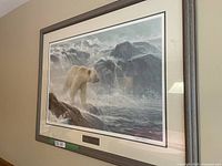 Framed print hanging on wall showing full image and frame