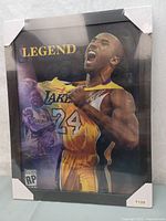 Front view of the framed Kobe Bryant poster with 'LEGEND' text and intense action shots