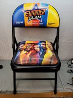 Front view of entire folding chair showing backrest and seat graphics