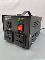 Front angle view of SEYAS AT-500 transformer showing power outlets, power LED indicators, and power switch.