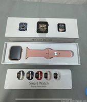 White box with T-500 Plus smartwatch and pink band inside, box showing watch face style images and model name