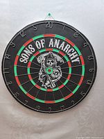 Front side of the dartboard with Sons of Anarchy logo and standard dartboard layout.