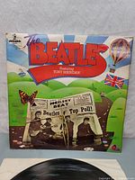 Front cover of The Beatles Featuring Tony Sheridan vinyl album showing colorful artwork and band image.