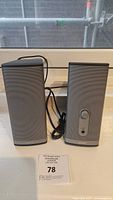 Photo showing both Bose Companion 2 Series II speakers side by side with cables visible.