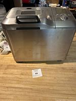 Front and side view showing stainless steel body and brand engraving