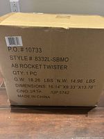 Photo of the closed cardboard box of Ab Rocket Twister showing dimensions, weight, and product style and model info.