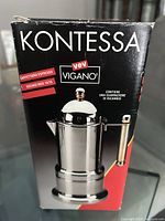 Photo of the original box showing Kontessa brand and Vev Vigano logo, with text indicating 'caffettiera espresso' and spare gasket included.