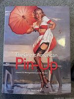 Front cover of The Great American Pin-Up book showing vintage pin-up illustration and title.