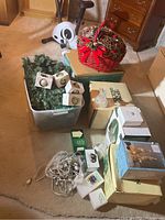 Overall contents: porcelain sets, Schmid ornament boxes, garland bin, basket, string lights, LED glass décor