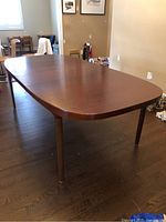 Full view of extended table with one leaf inserted