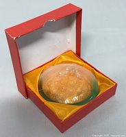 Natural jade bangle bracelet placed inside its original red box with yellow silk lining and bubble wrap inside the bangle for protection.