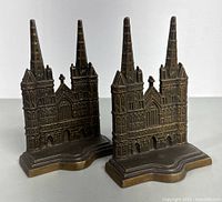 Front view of both bookends showing cathedral facade and base contours