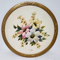 Front view of the round floral painting with gold frame showing the artwork and frame condition.