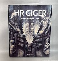 Front cover of HR Giger hardcover book showing biomechanical artwork and title.