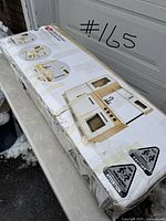 Box of the Anko Wooden Retro Kitchen Playset showing the model on the packaging along with warnings and condition of the box