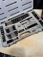 Full view of the open Husky tool case showing most of the tools inside including various sockets and ratchets arranged in designated slots.