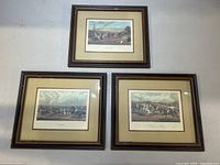 Three framed horse racing prints titled The Start, Saddling, Ready for a Canter arranged to show the set and frame condition.