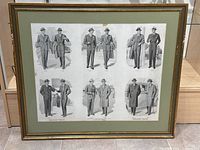 Full view of framed vintage advertisement print showing all six illustrated pairs of men’s fall/winter fashion outfits including suits and overcoats.