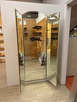 Front view showing all three panels slightly angled open