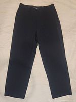 Full view of navy blue Armani men's dress pants laid flat showing front and overall condition.