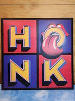 Front of gatefold jacket with HONK lettering and tongue logo