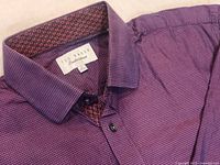 Close-up image of Ted Baker Endurance shirt collar with inside detail showing purple check pattern and contrasting inner collar lining with purple/red/black geometric pattern.