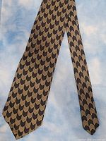 Front view of the Valentino silk necktie showing overall pattern and condition.