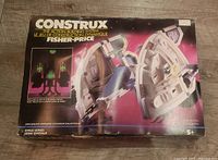 Top view of the original box showing the Construx 6455 Galaxy Voyager set with colorful space theme design and Fisher-Price branding.