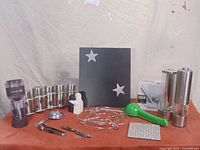 Photo showing full view of kitchen items including spice rack, aerator, juicer, grater and tools.