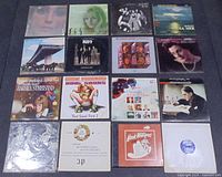 Record lot photo showing 16 vinyl records including Kiss, Barbra Streisand and others
