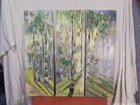 Full view of the 3 piece set of birch tree and butterfly acrylic paintings on canvas displayed side by side.