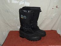 Side view of the pair of black Windriver men's winter boots, size 10, showing rugged soles and logo with -70° mark.
