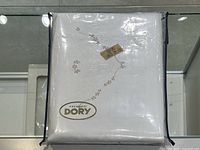 Full packaged white sheet set with embroidered floral and lace design, brand label Creazioni Dory visible.