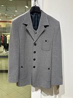 Full front view of vintage grey blazer showing buttons, collar, and front pockets.