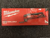 Front of the box showing Milwaukee branding, image of the Multi-Tool, M12 branding, and model number 2426-20.