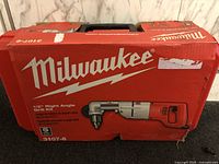 Front of red Milwaukee carrying case showing logo and product illustration