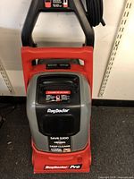 Front view of the Rug Doctor Pro upright machine showing brand decals and advertising sticker