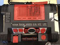 Top and front view of Vector power station showing key features labeled including 1200A jump starter, 500W power inverter, and LED worklight.