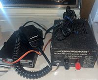 Photo showing the Micronta regulated power supply unit next to the Radio Shack CB radio and microphone.