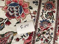 Close-up of the floral quilting pattern and fabric label with lot number 824.