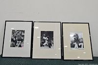 Three framed Pittsburgh Steelers photos including Jack Lambert, Lynn Swann, and Mel Blount autographed photo.