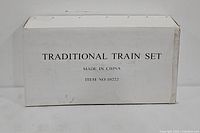 Plain cardboard box labeled Traditional Train Set, Item No 10222, Made in China.