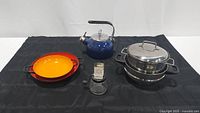 Image showing all five items in the lot: two enamel pans, blue enamel teapot, nut grinder, and stainless steel broiler pan set.