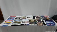 Wide view of assorted political items spread on a table including photos, stickers, and flags.