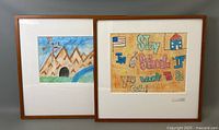 Two framed children's artworks: a mountain landscape and a motivational text art.